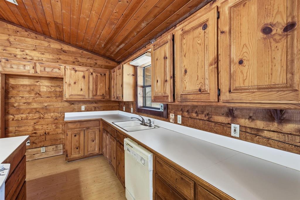 504 Windsor Lane Springtown, TX 76082 - Photo 18 of 40 a kitchen with stainless steel appliances a sink dishwasher a stove a refrigerator and cabinets
