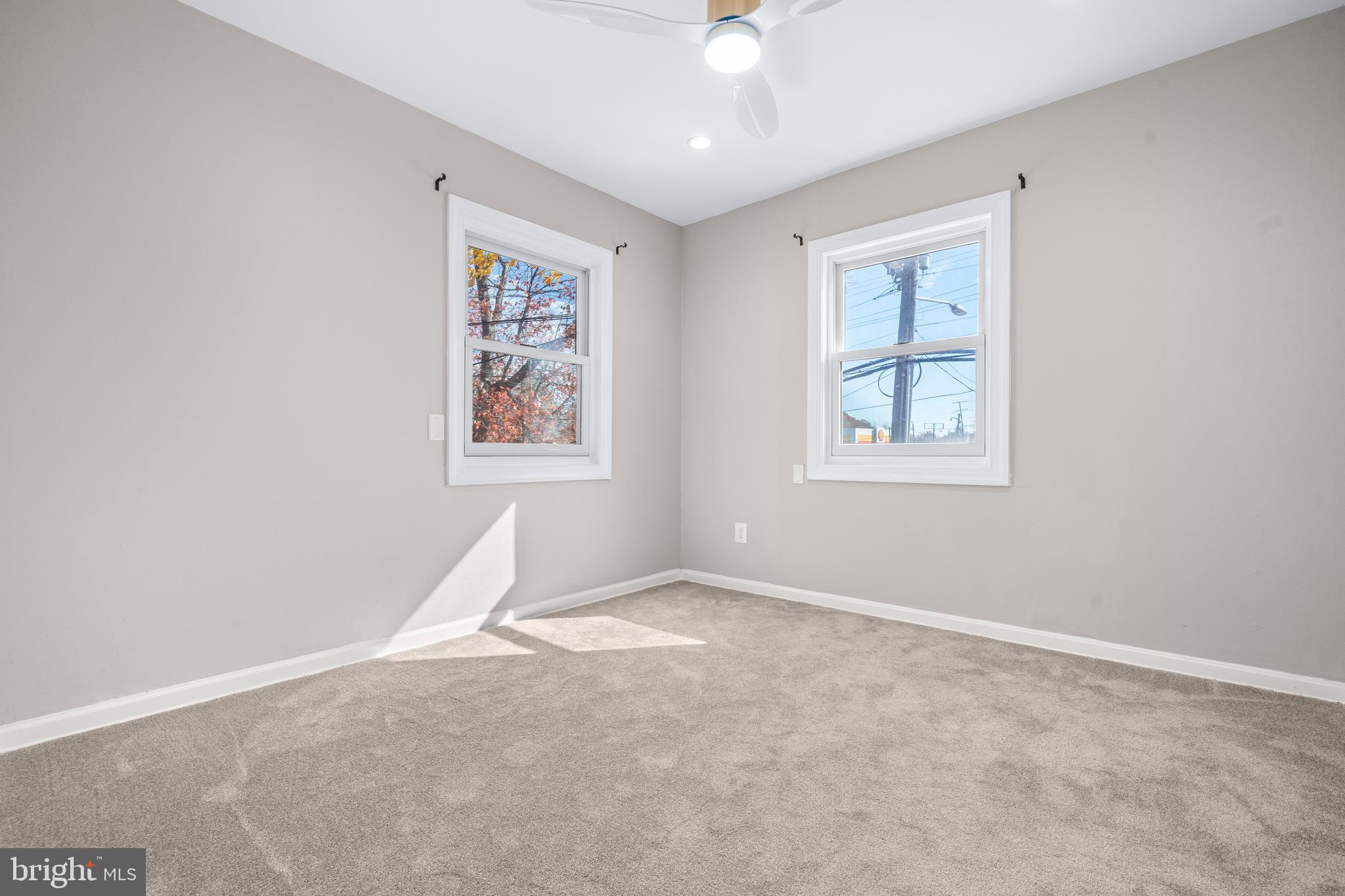 4314 Wheeler Road Southeast Washington, DC 20032 - Photo 19 of 36 an empty room with windows and fan