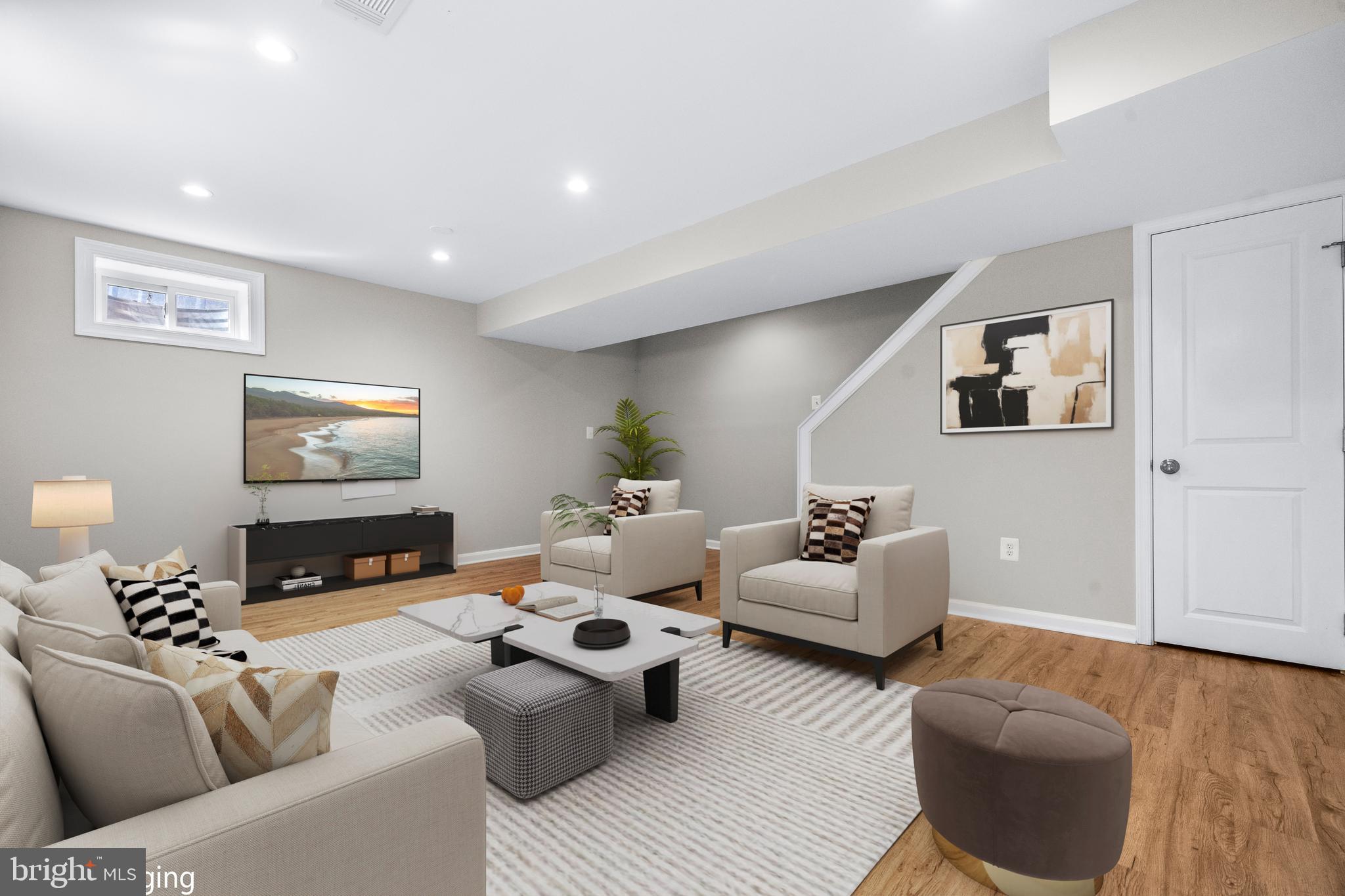4314 Wheeler Road Southeast Washington, DC 20032 - Photo 23 of 36 a living room with furniture and a flat screen tv