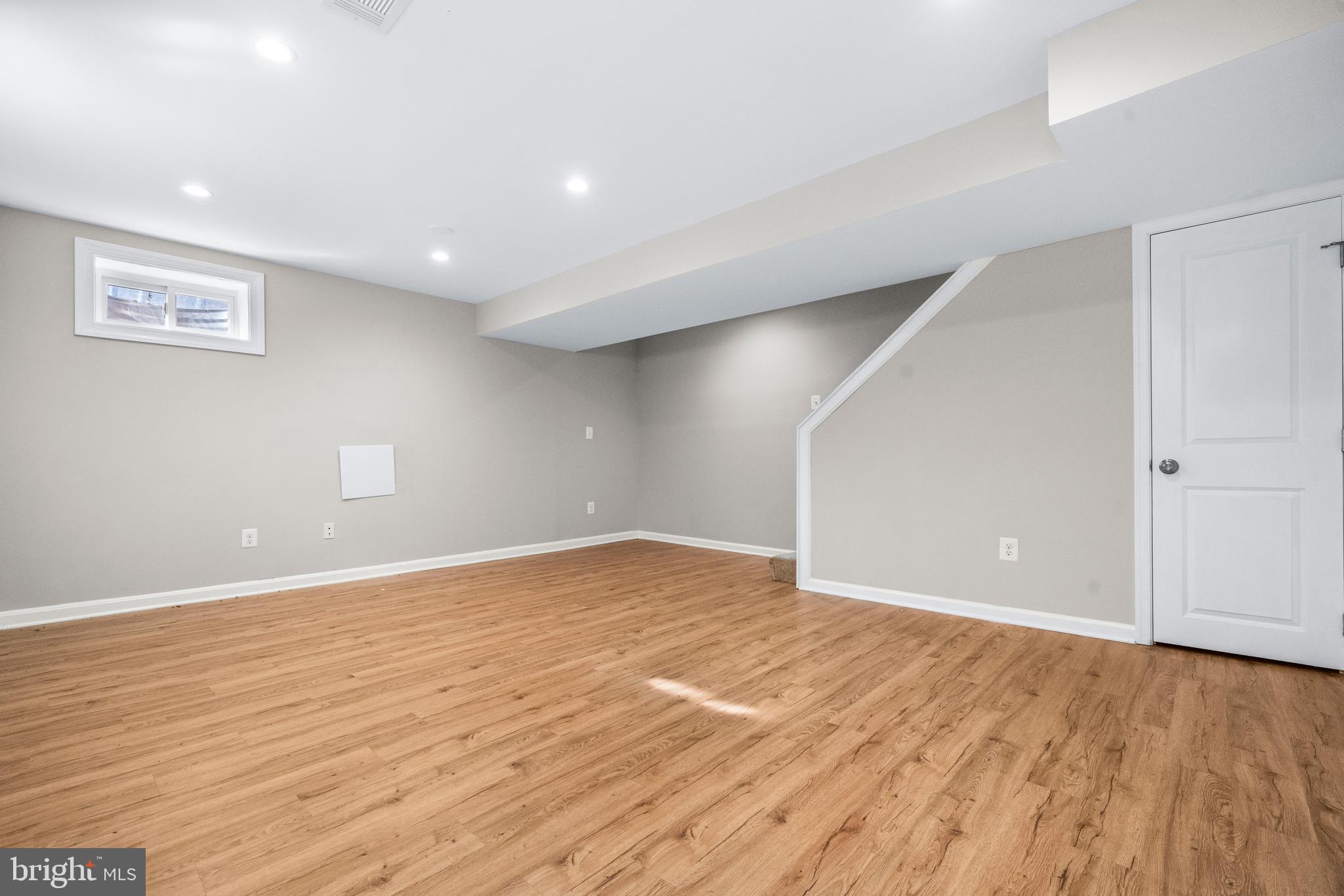 4314 Wheeler Road Southeast Washington, DC 20032 - Photo 24 of 36 a view of an empty room with wooden floor and a window