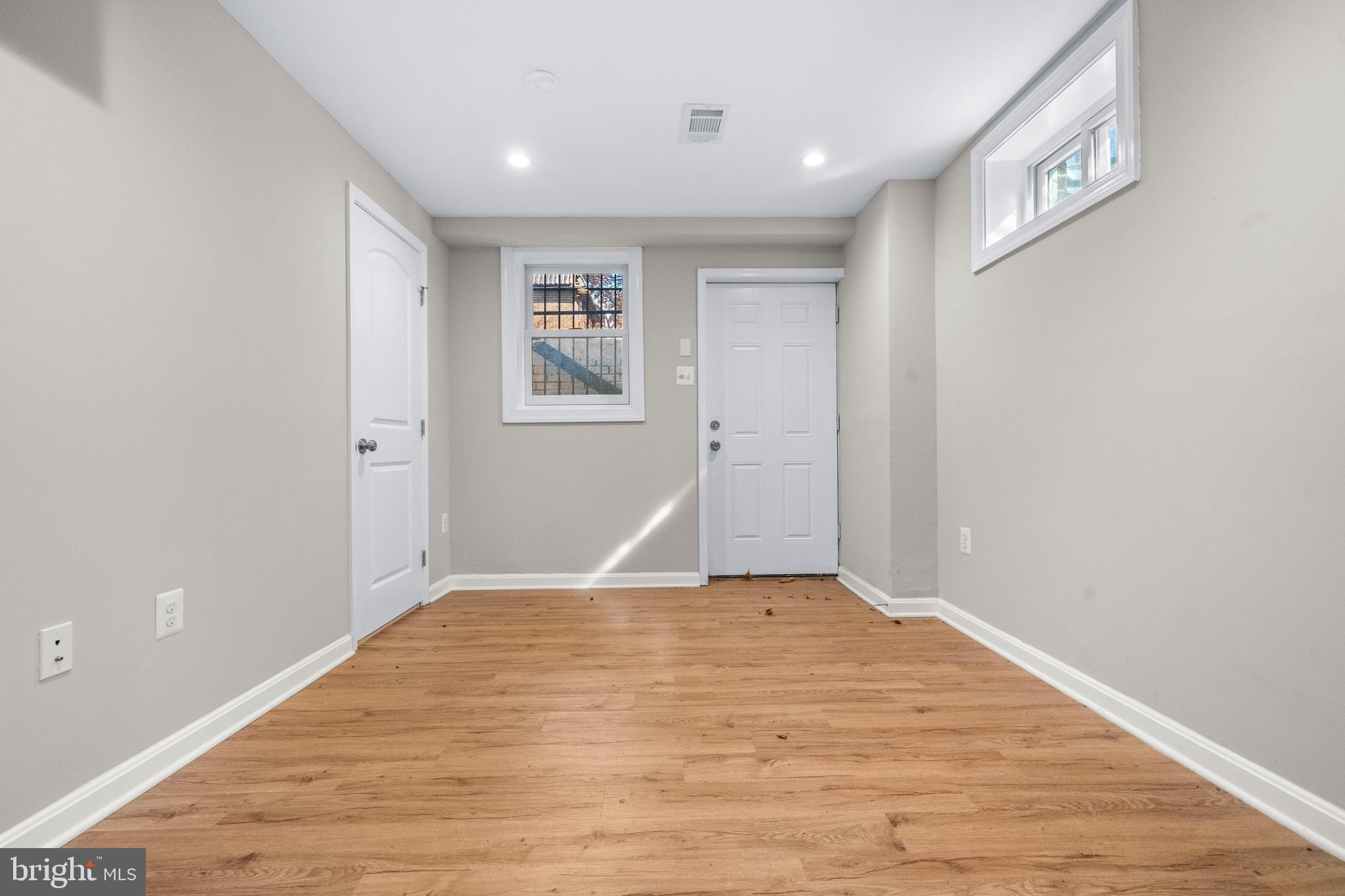 4314 Wheeler Road Southeast Washington, DC 20032 - Photo 26 of 36 a view of empty room with wooden floor