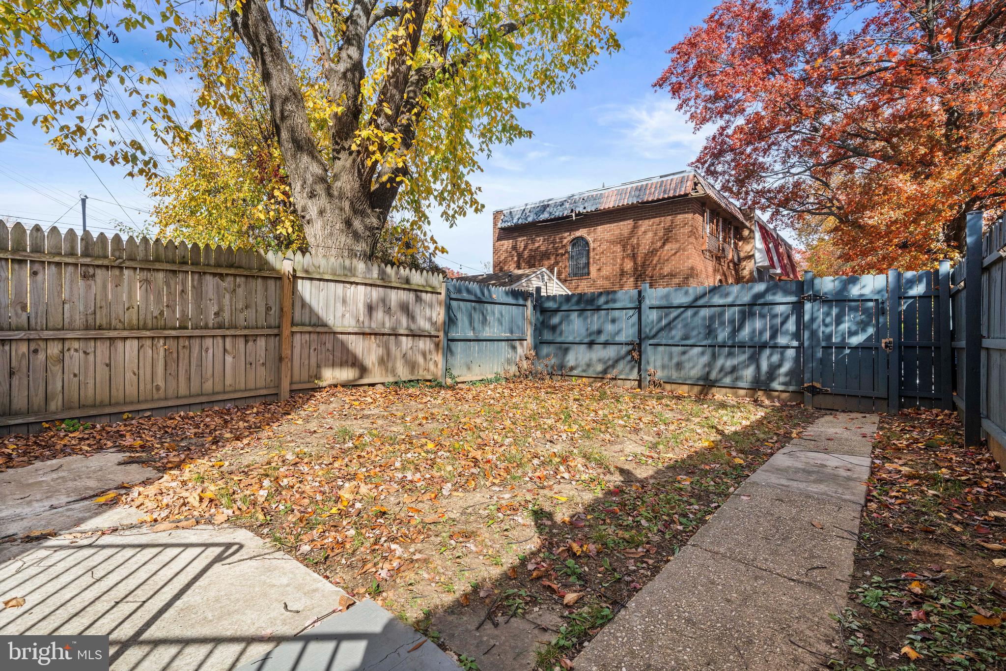 4314 Wheeler Road Southeast Washington, DC 20032 - Photo 29 of 36 a backyard of a house with wooden fence