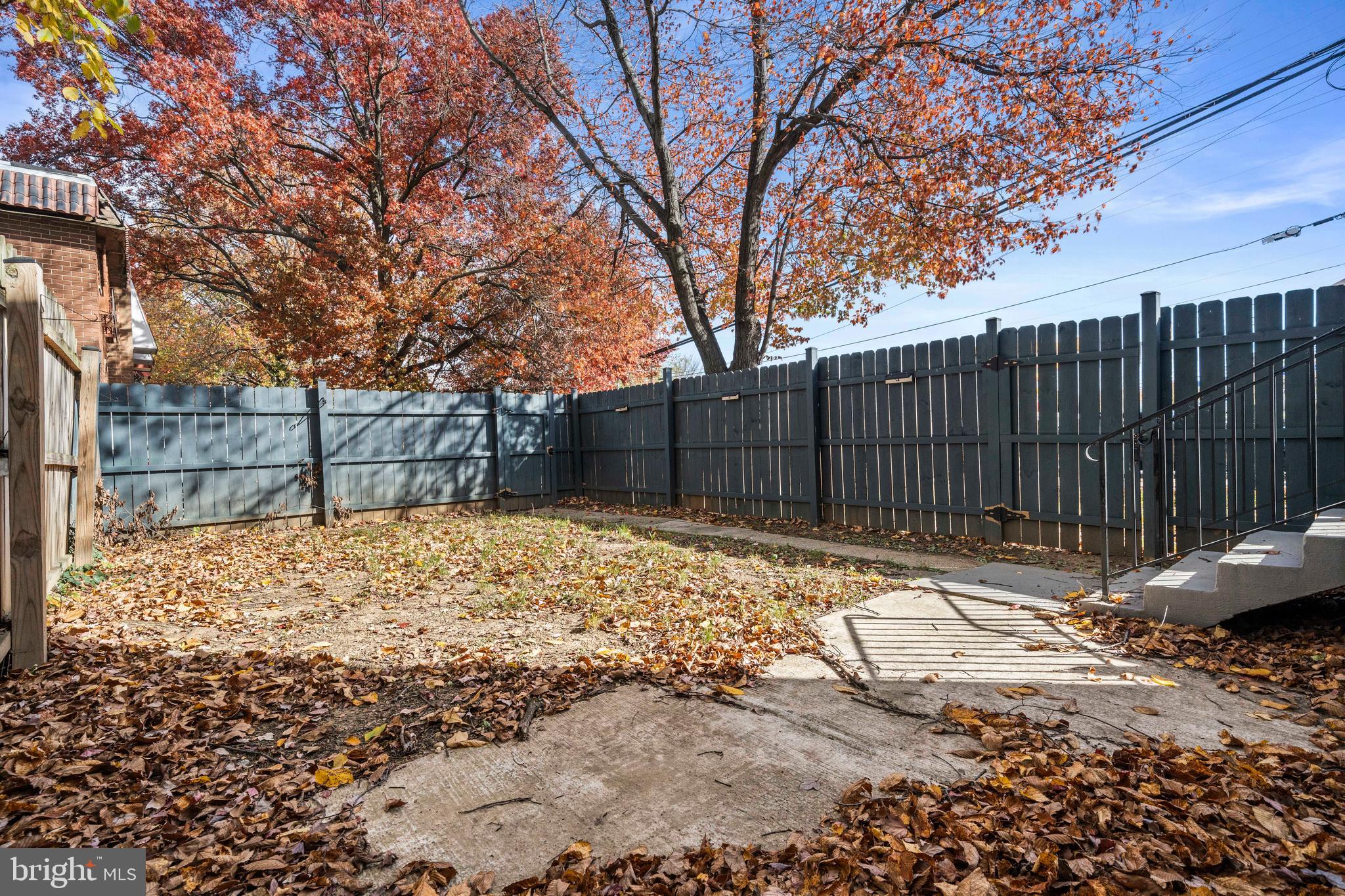 4314 Wheeler Road Southeast Washington, DC 20032 - Photo 33 of 36 a backyard of a house with wooden fence