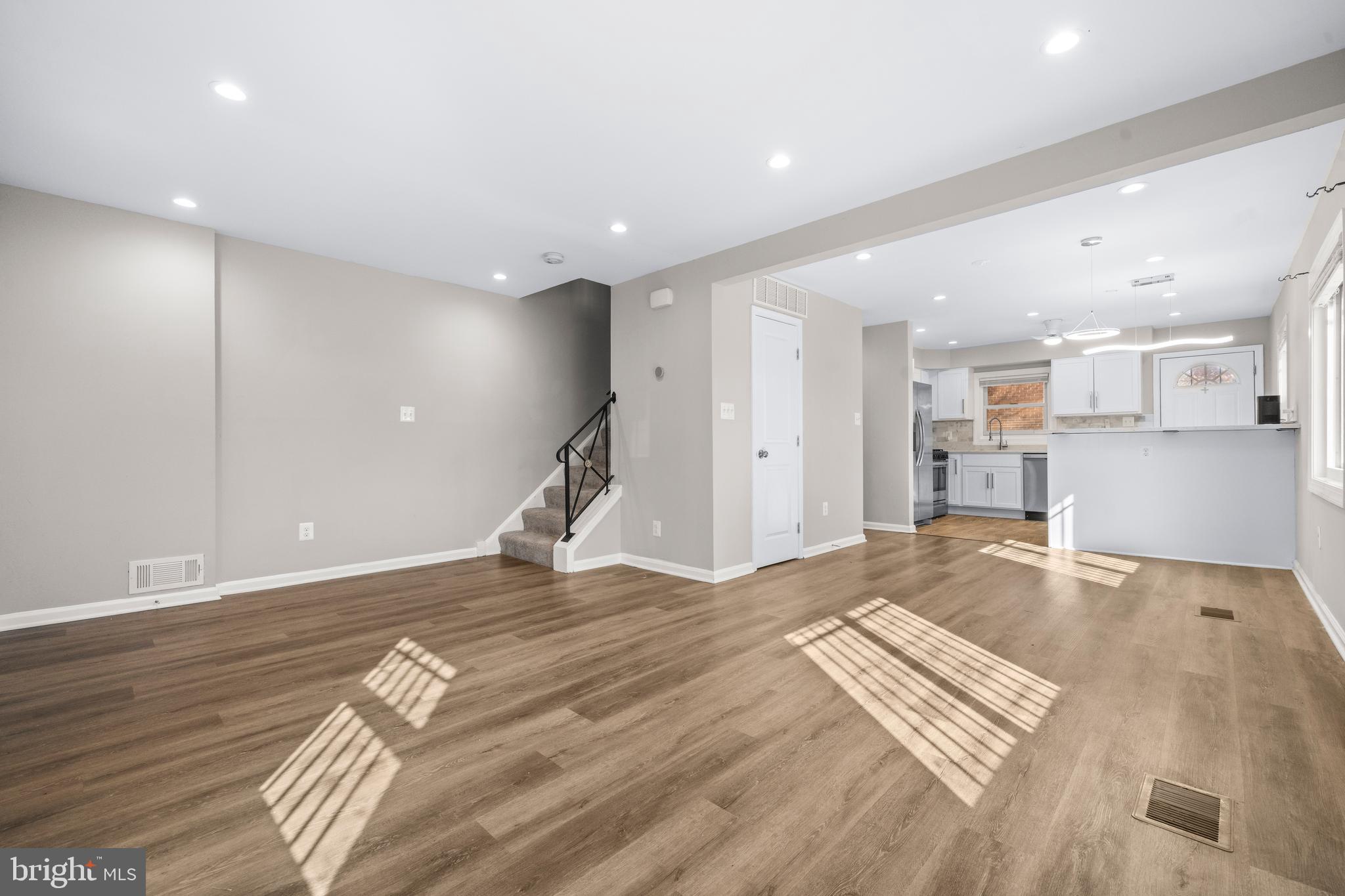 4314 Wheeler Road Southeast Washington, DC 20032 - Photo 5 of 36 a view of a kitchen with a sink and a stove