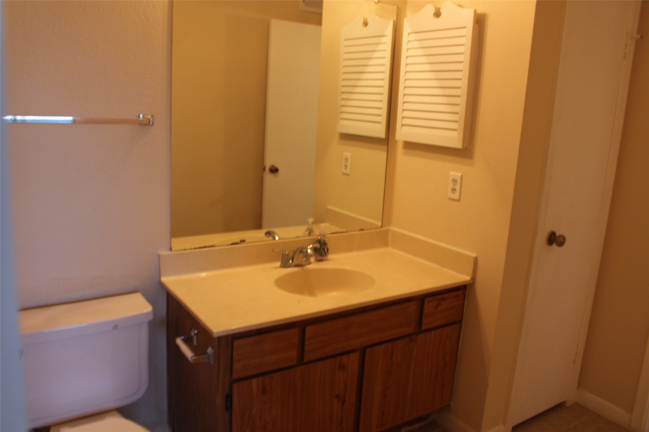 16111 Aspenglen Drive, Unit 806 Houston, TX 77084 - Photo 13 of 15 a bathroom with a sink and a mirror