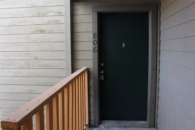 a view of an empty room with glass door