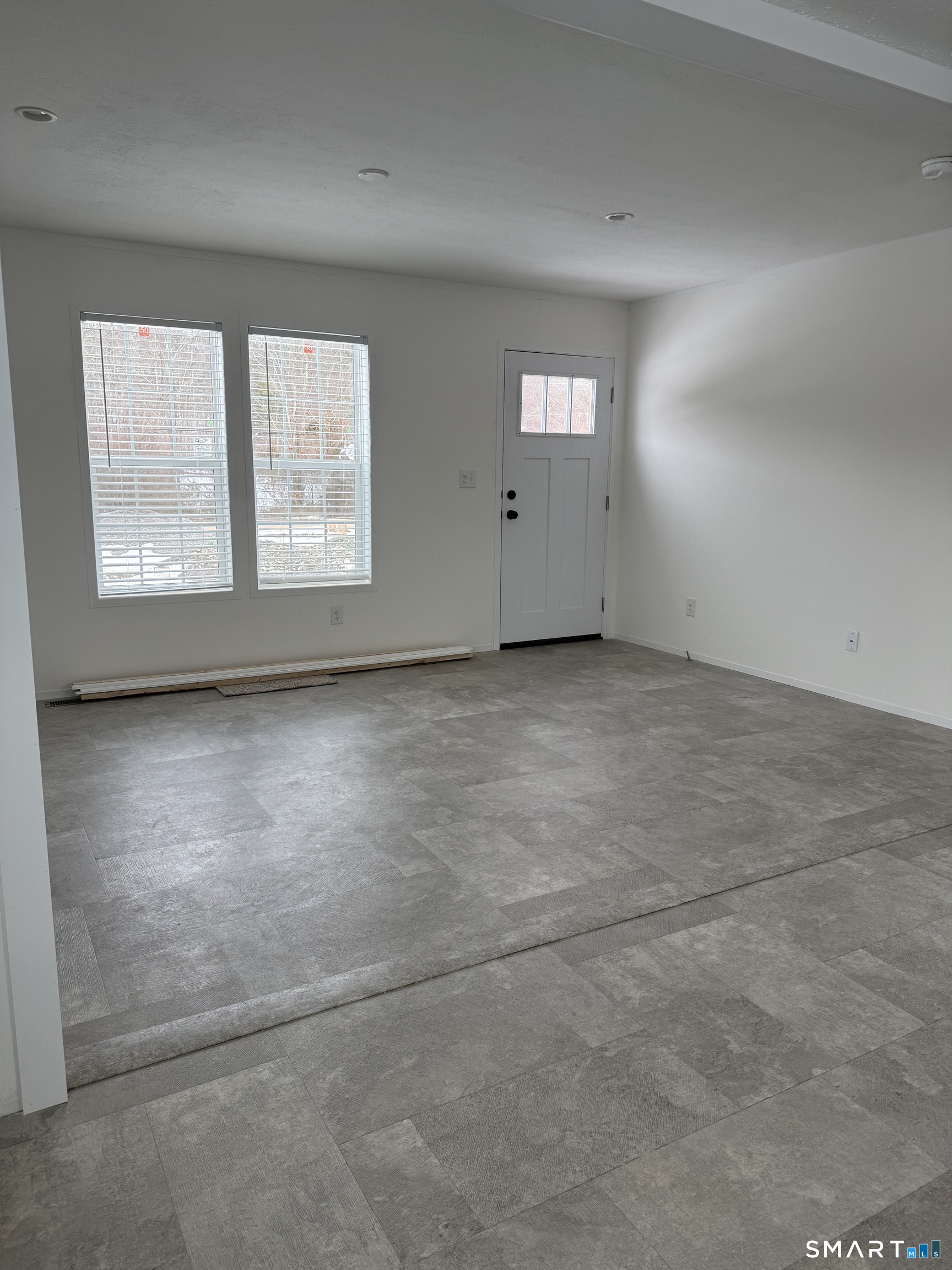 3-421 Norwich-Westerly Road Mashantucket, CT 06338 - Photo 2 of 13 an empty room with windows