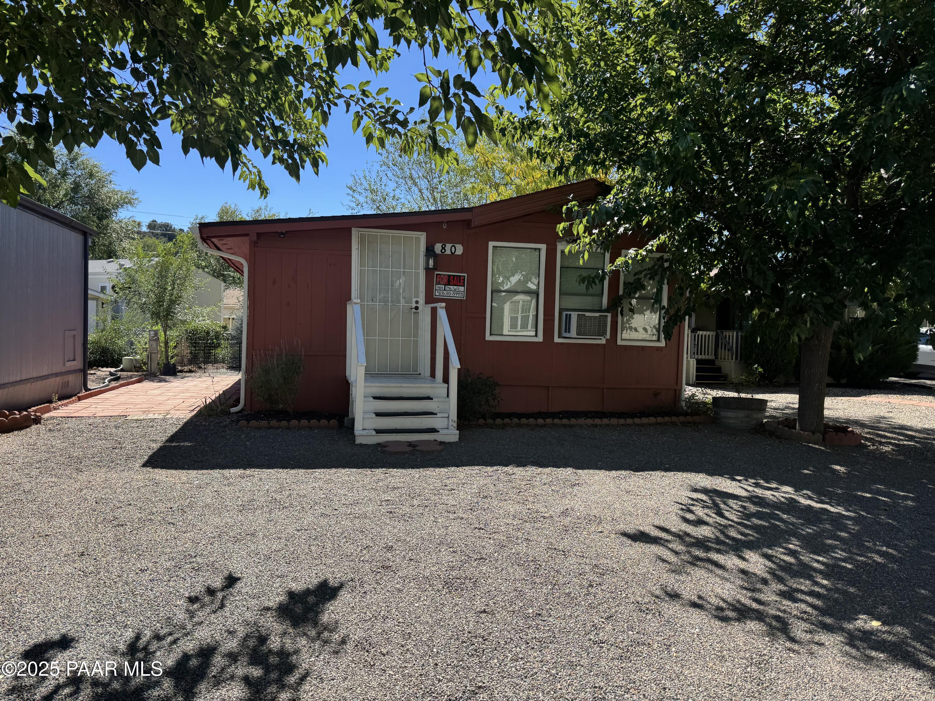 11250 East State Rte 69, Unit 80 Prescott Valley, AZ 86314 - Photo 1 of 13 a view of a house with a yard and tree s