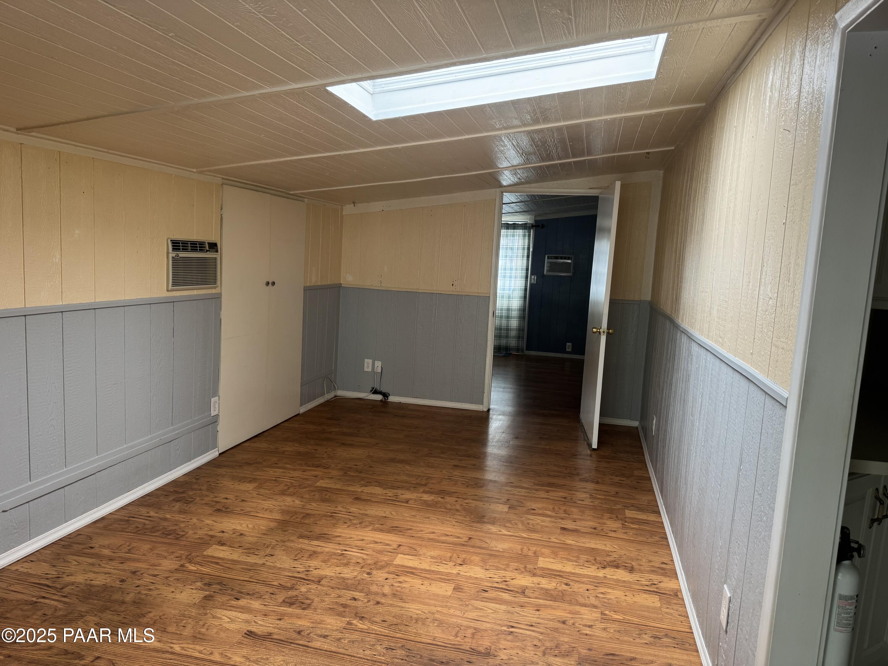11250 East State Rte 69, Unit 80 Prescott Valley, AZ 86314 - Photo 3 of 13 a view of empty room with wooden floor