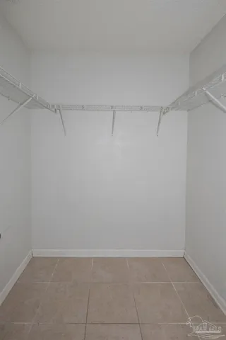 a view of a room with shelf on the wall