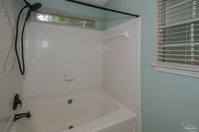 a close view of a bathtub in bathroom