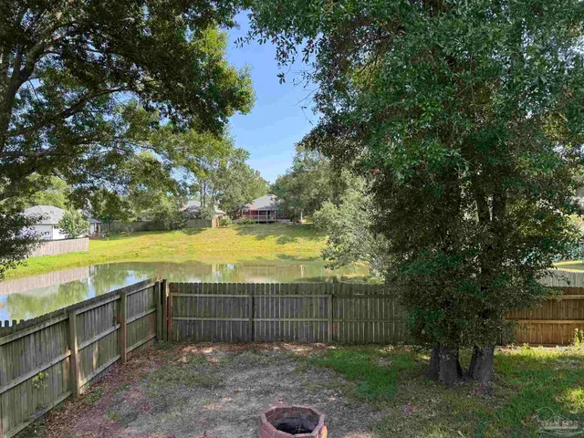 a view of a backyard with a lake view