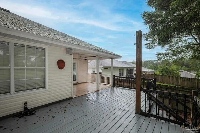a view of a chairs and table on the wooden deck