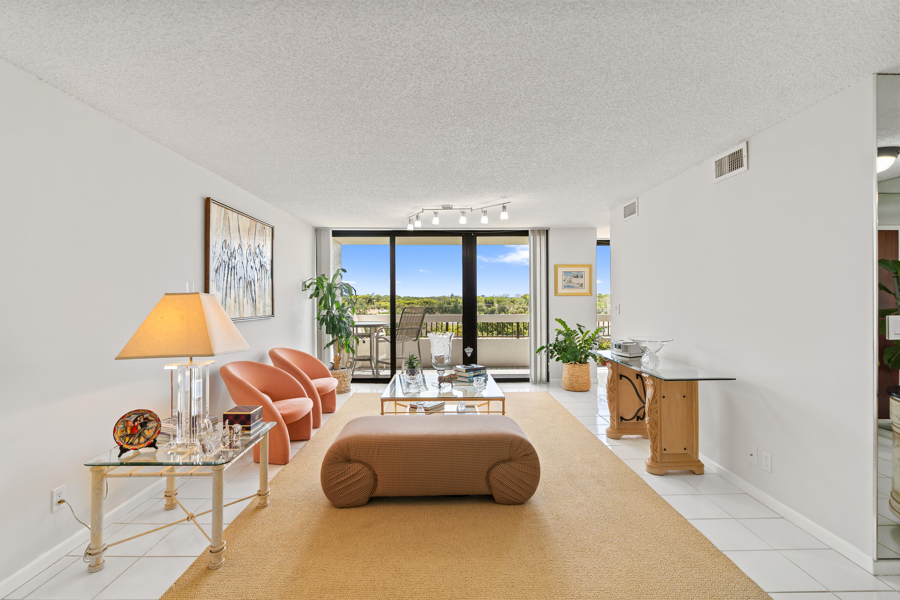 23200 Camino Del Mar, Unit 603 Boca Raton, FL 33433 - Photo 8 of 43 a living room with furniture and a large window