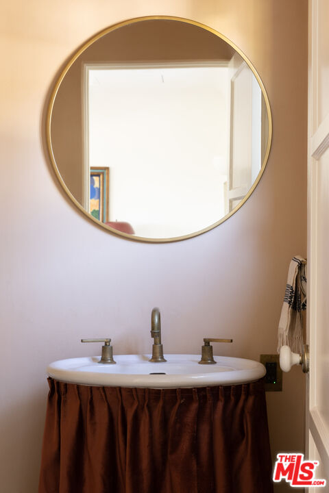 2226 Moreno Drive Los Angeles, CA 90039 - Photo 20 of 65 a bathroom with a sink and a mirror