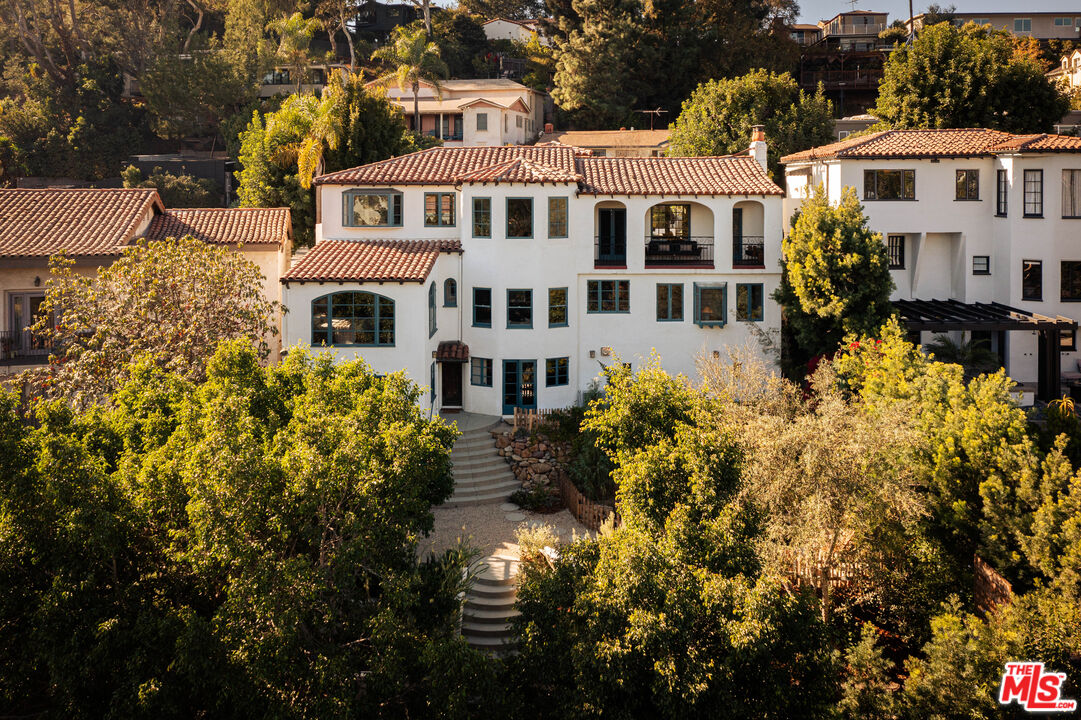 2226 Moreno Drive Los Angeles, CA 90039 - Photo 2 of 65 a front view of a house with a yard and fountain in middle
