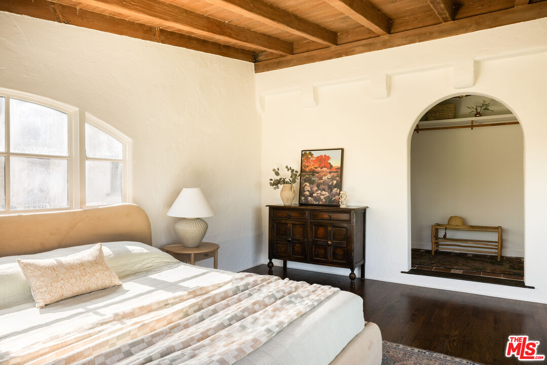 2226 Moreno Drive Los Angeles, CA 90039 - Photo 24 of 65 a bedroom with a bed and a dresser with wooden floor
