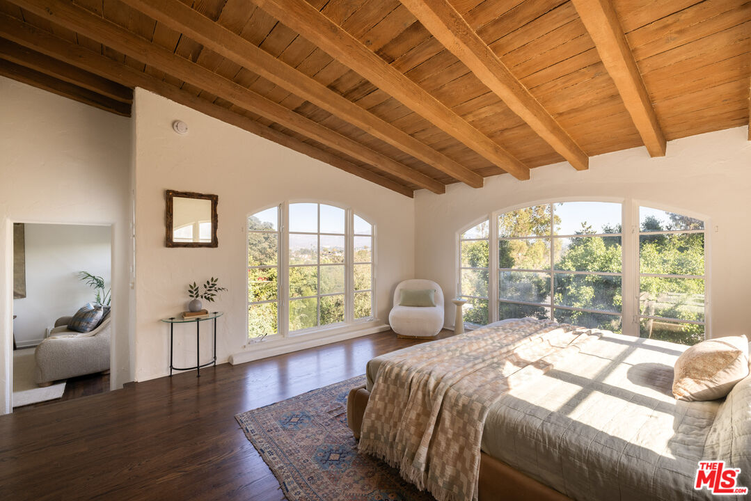 2226 Moreno Drive Los Angeles, CA 90039 - Photo 25 of 65 a bedroom with a large bed and a large window