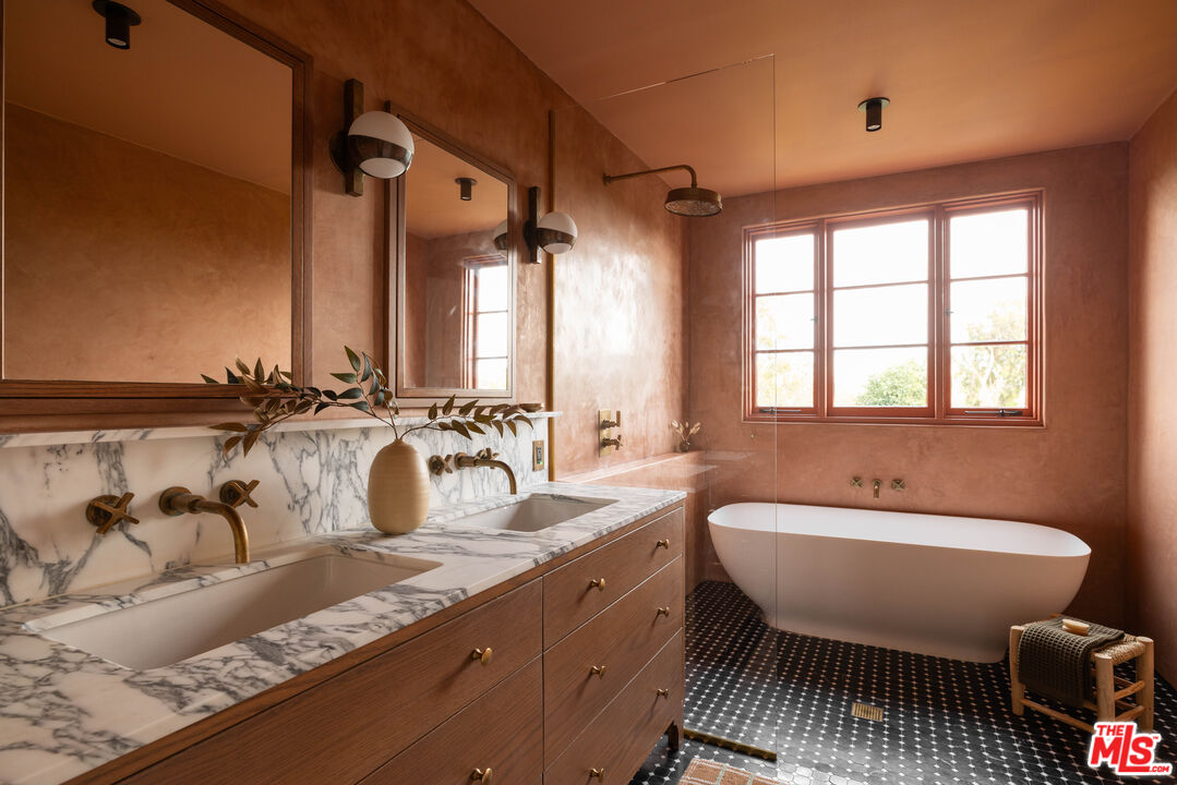 2226 Moreno Drive Los Angeles, CA 90039 - Photo 29 of 65 a spacious bathroom with a double vanity sink a mirror and a bathtub