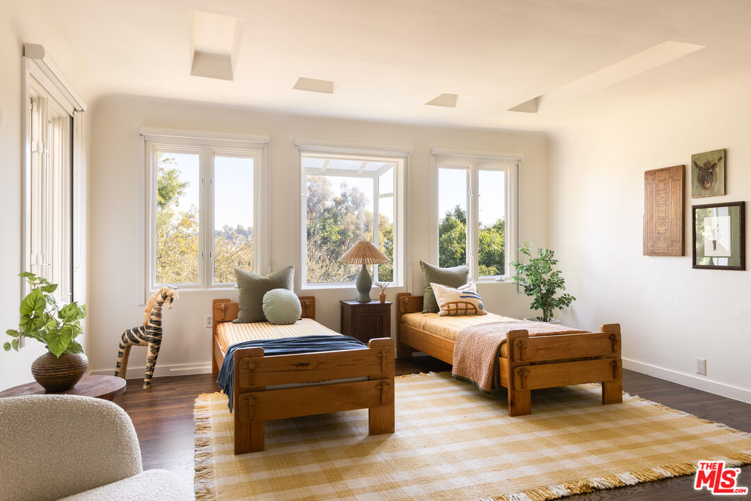 2226 Moreno Drive Los Angeles, CA 90039 - Photo 34 of 65 a bedroom with a bed and large windows