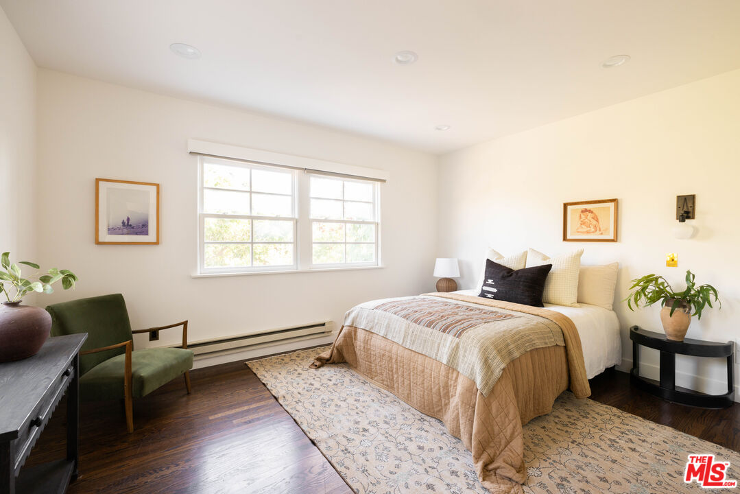 2226 Moreno Drive Los Angeles, CA 90039 - Photo 39 of 65 a bedroom with a bed and wooden floor