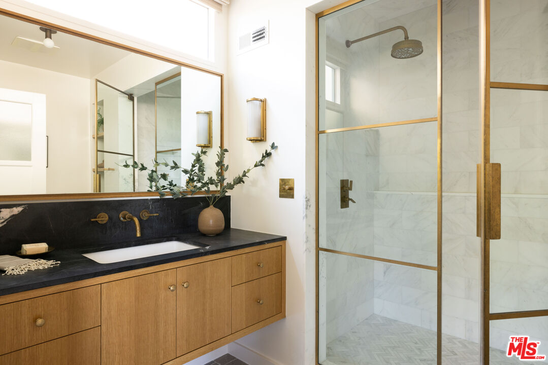 2226 Moreno Drive Los Angeles, CA 90039 - Photo 40 of 65 a bathroom with a sink and a mirror