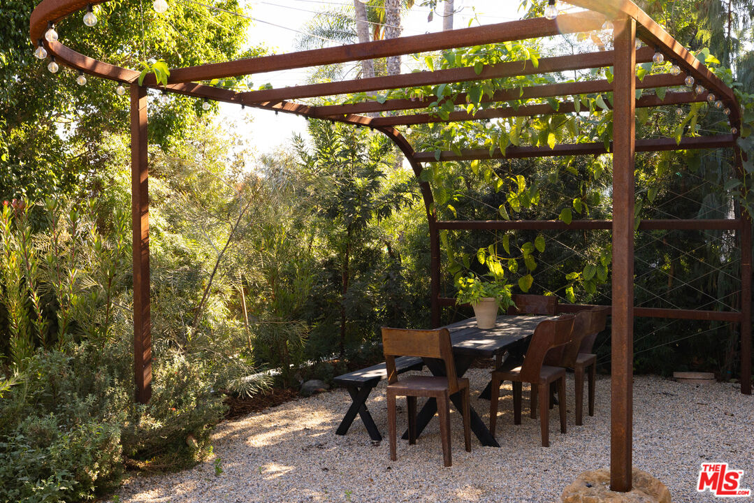 2226 Moreno Drive Los Angeles, CA 90039 - Photo 49 of 65 a view of a patio with table and chairs and potted plants