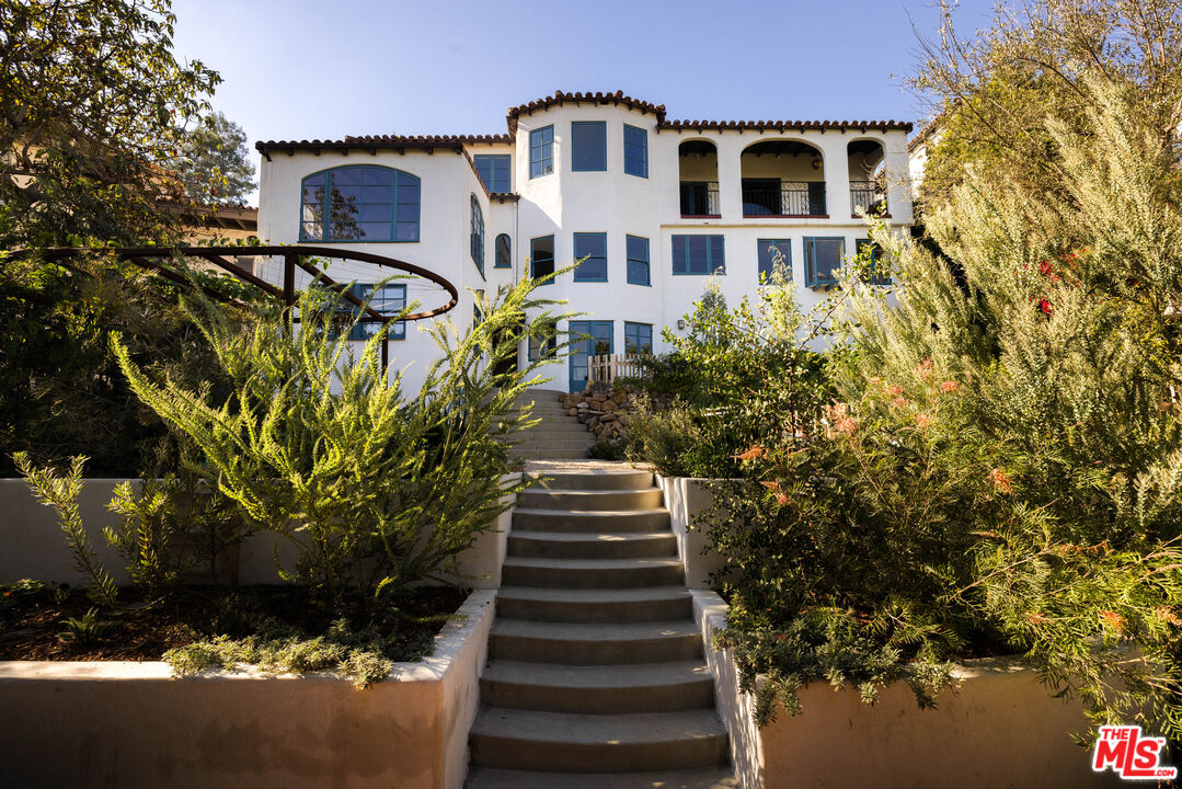 2226 Moreno Drive Los Angeles, CA 90039 - Photo 50 of 65 a front view of a house with a yard