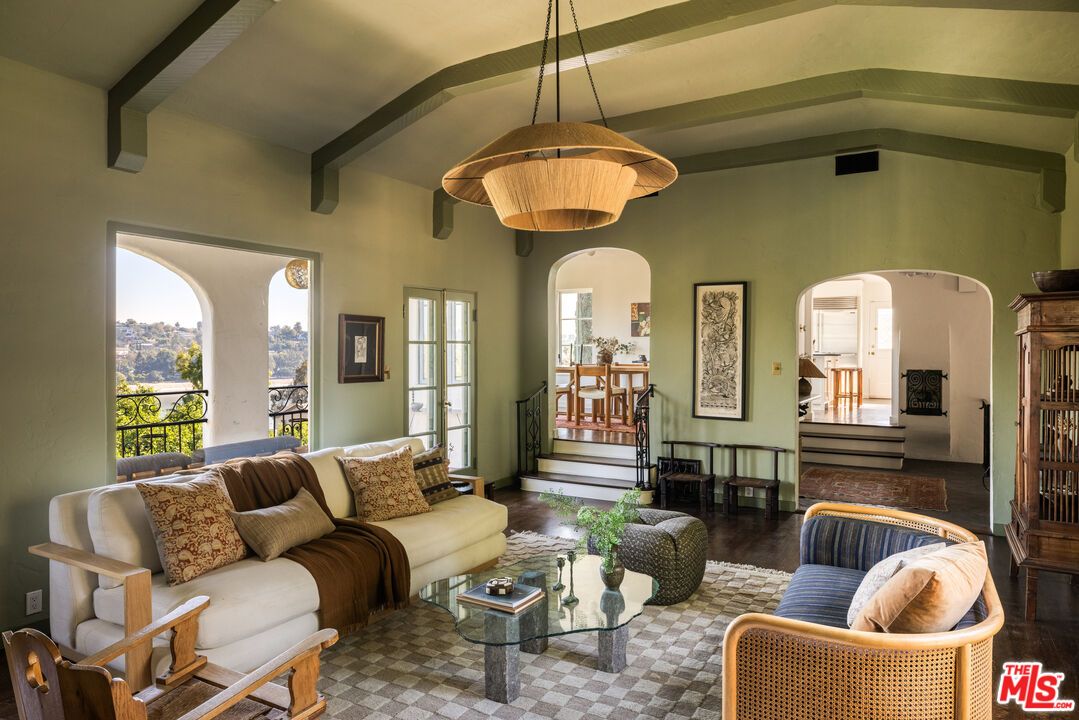 2226 Moreno Drive Los Angeles, CA 90039 - Photo 8 of 65 a living room with furniture a fireplace and large windows