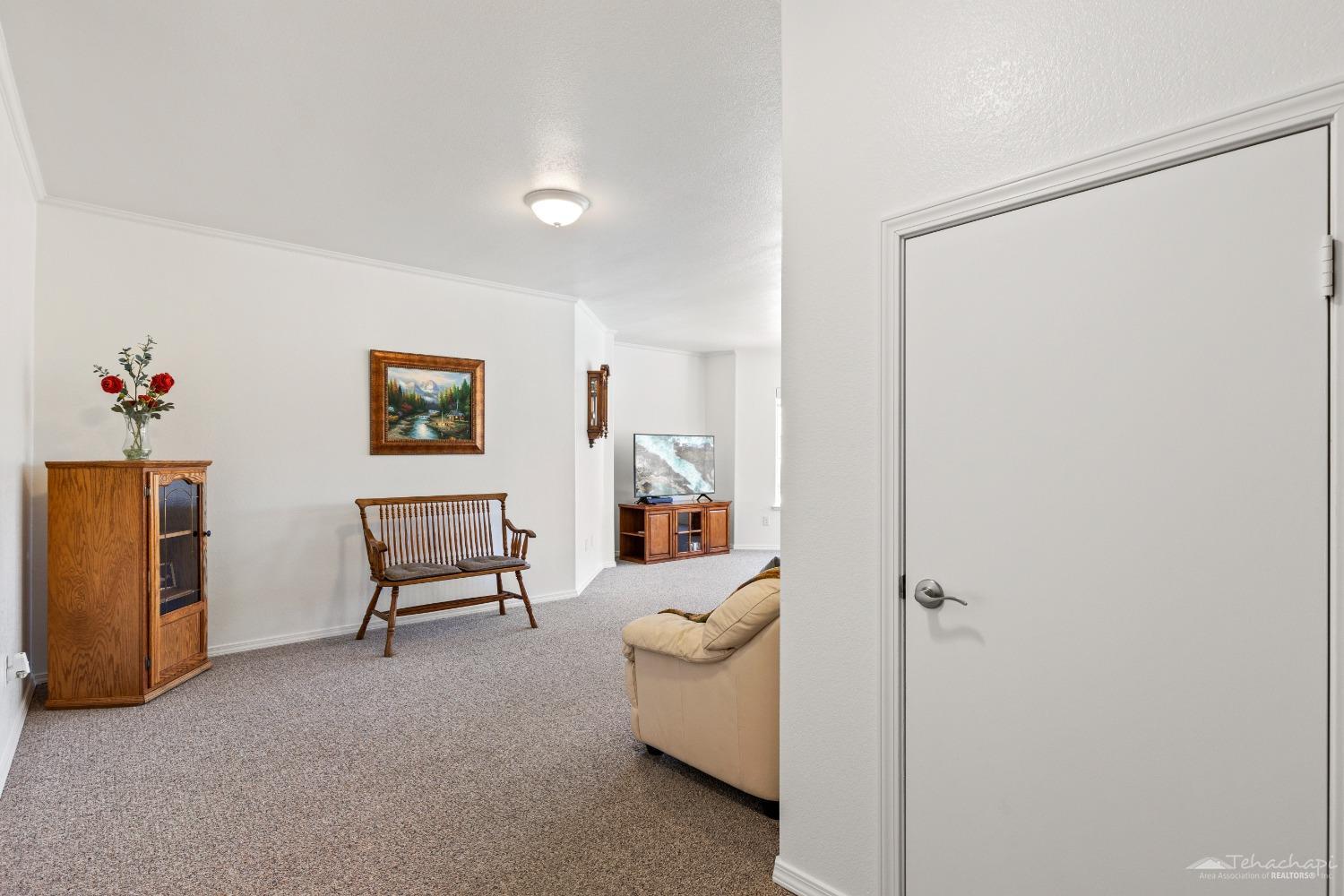 20431 Old Town Road Tehachapi, CA 93561 - Photo 52 of 89 Downstairs family room door to storage room