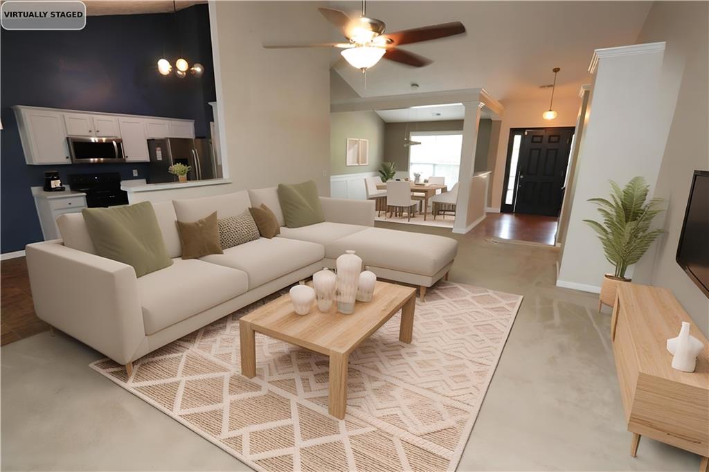 232 Harlan Heights Road Villa Rica, GA 30180 - Photo 2 of 9 a living room with furniture and a chandelier