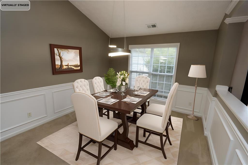 232 Harlan Heights Road Villa Rica, GA 30180 - Photo 5 of 9 a view of a dining room with furniture and wooden floor