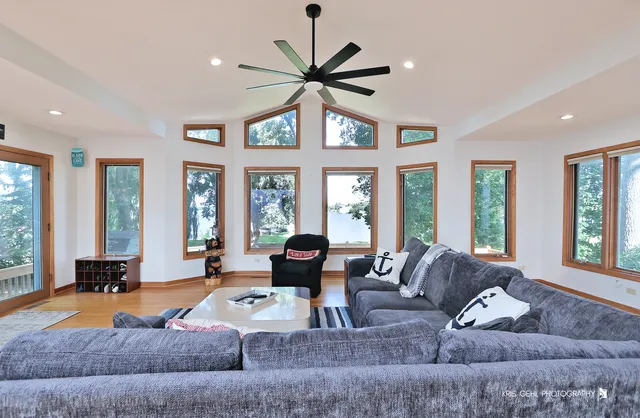 a living room with furniture and a large window