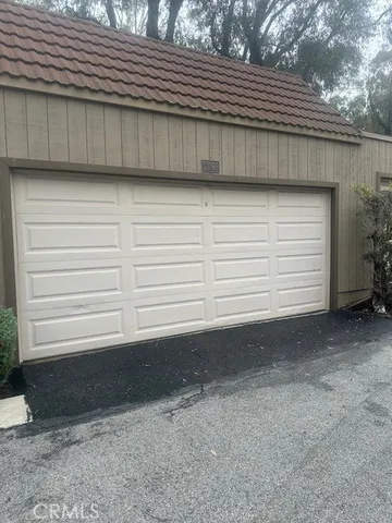 a view of backyard and garage