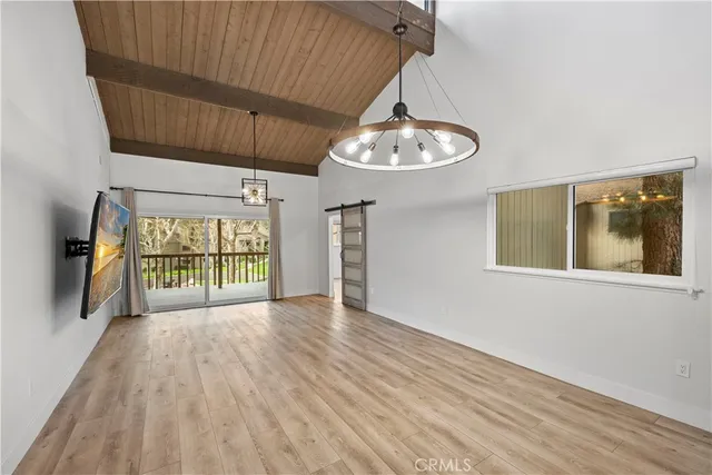 a view of a room with wooden floor and iron gate