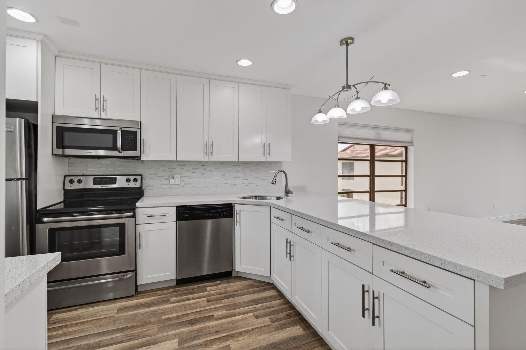 8536 Casa Del Lago, Unit 49B Boca Raton, FL 33433 - Photo 17 of 79 a kitchen with stainless steel appliances granite countertop a stove and cabinets