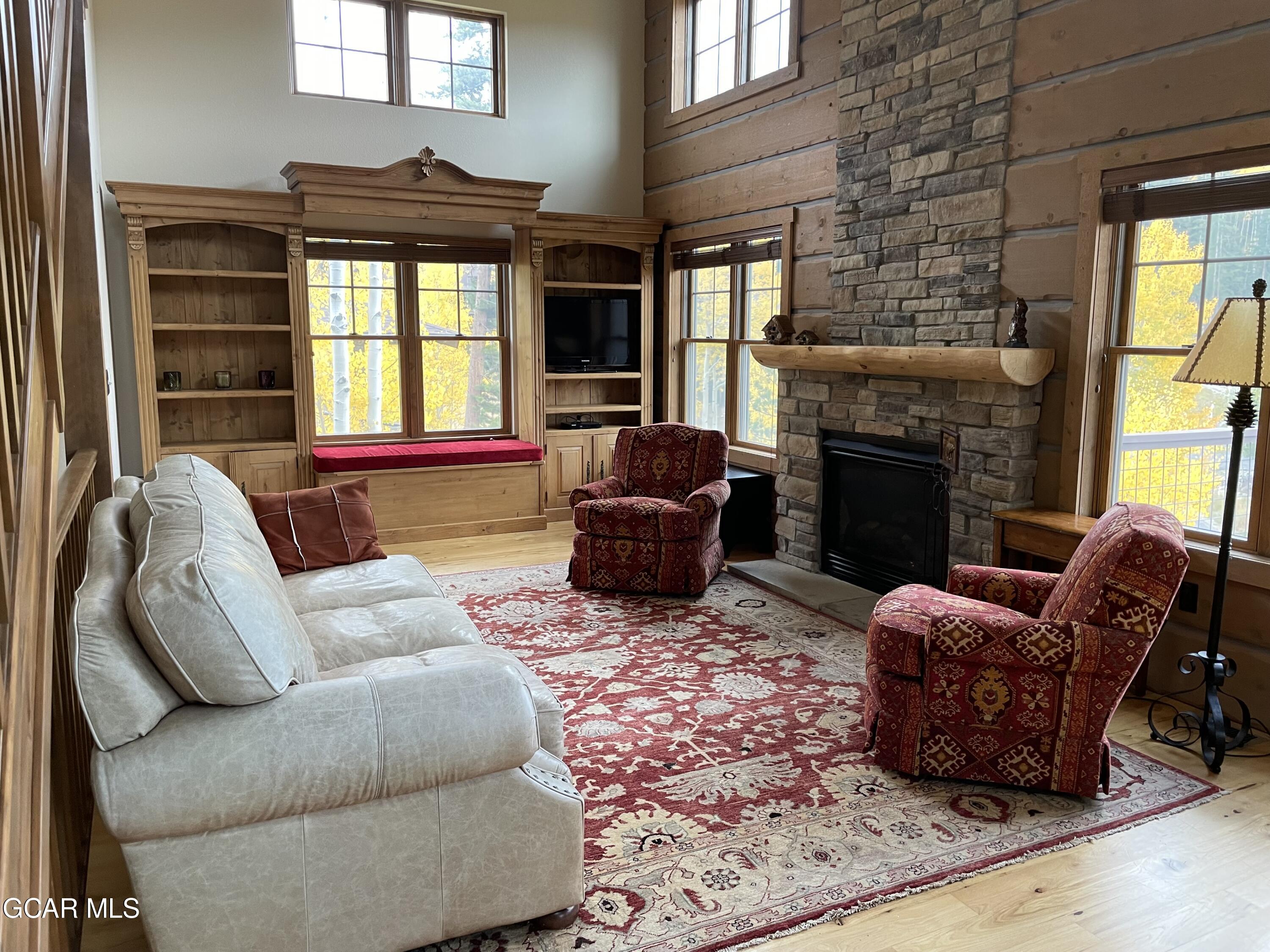 1180 Rendezvous Road Fraser, CO 80442 - Photo 11 of 44 a living room with furniture window and a fireplace