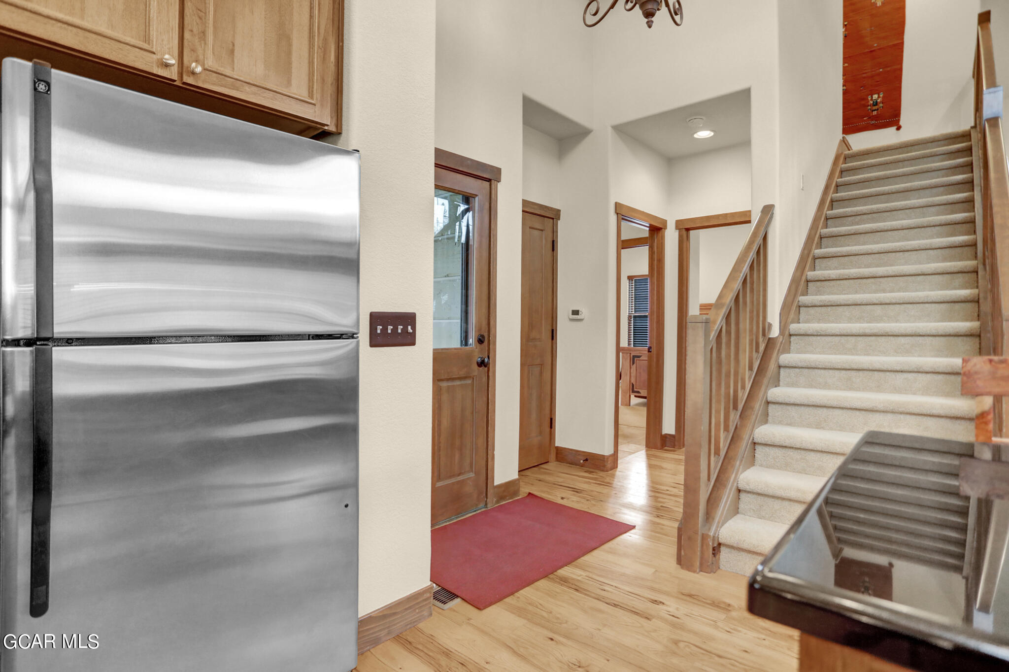 1180 Rendezvous Road Fraser, CO 80442 - Photo 12 of 44 a view of a hallway with wooden floor and staircase