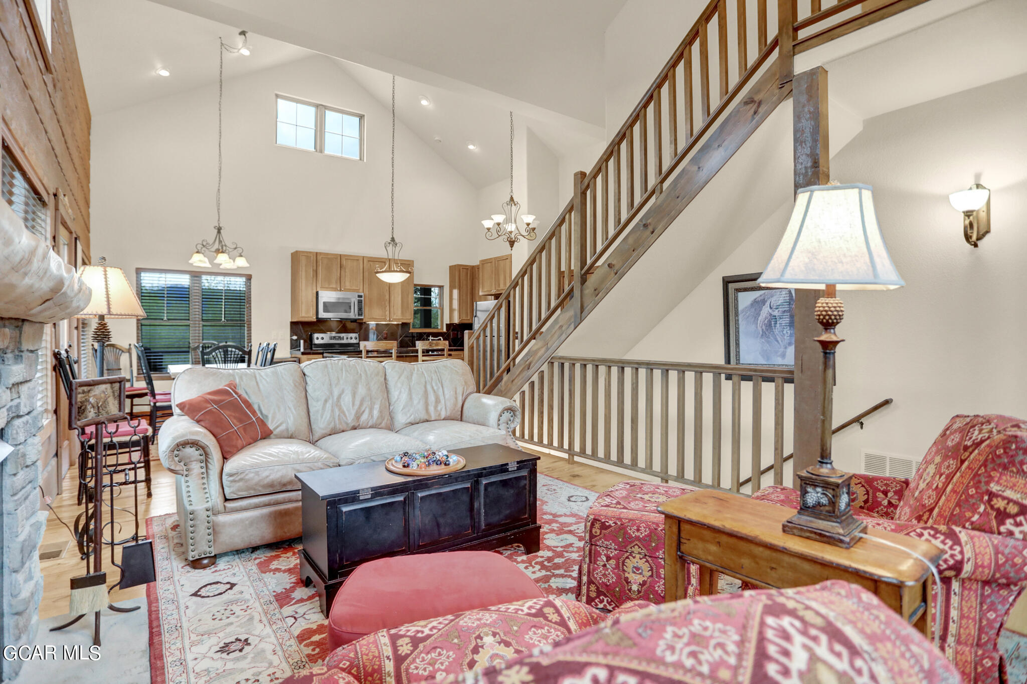 1180 Rendezvous Road Fraser, CO 80442 - Photo 13 of 44 a living room with furniture fireplace and a table