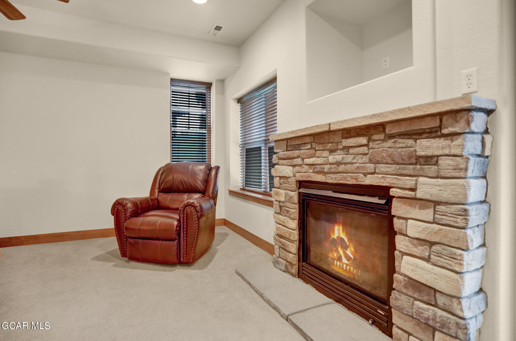 1180 Rendezvous Road Fraser, CO 80442 - Photo 20 of 44 a living room with furniture a flat screen tv and a fireplace