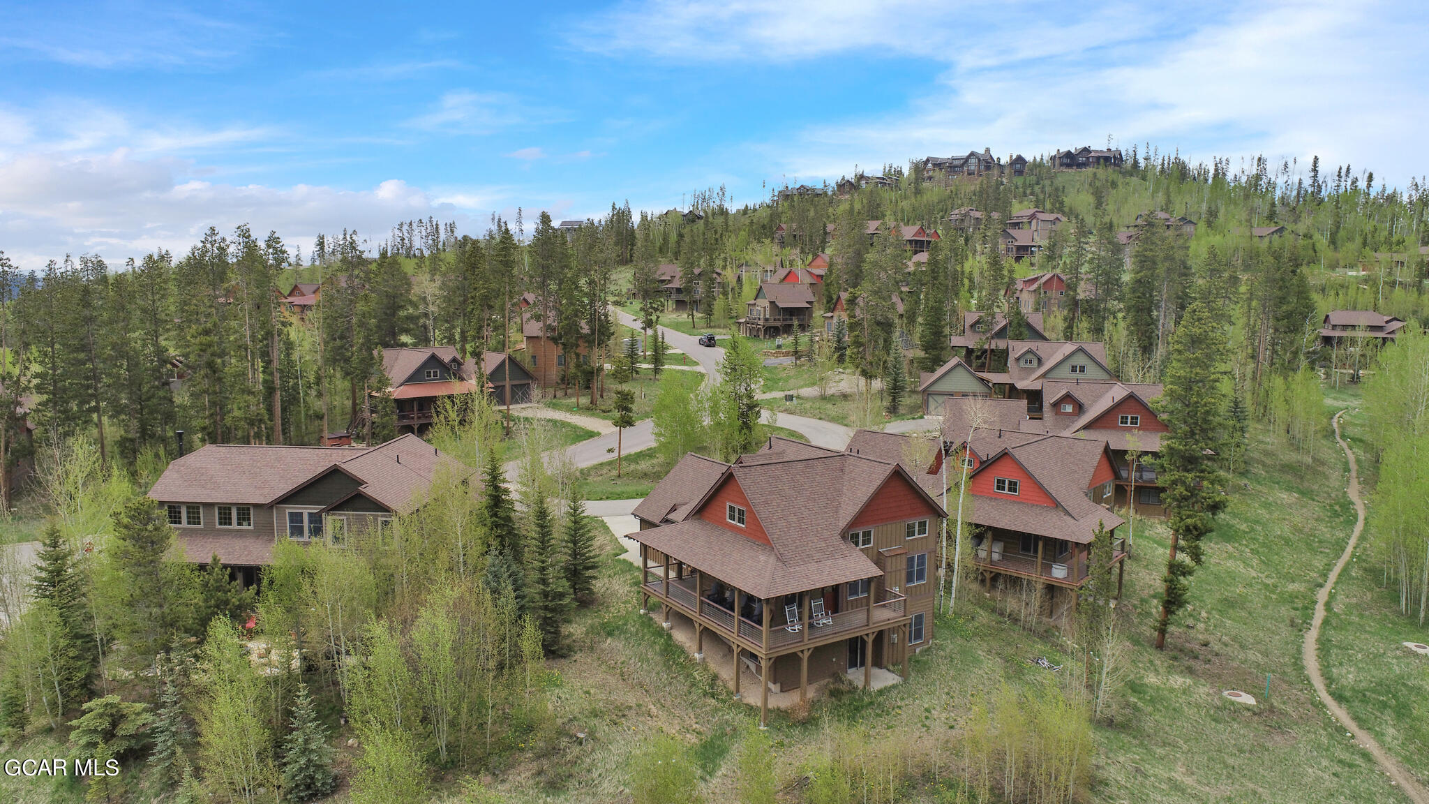 1180 Rendezvous Road Fraser, CO 80442 - Photo 2 of 44 a aerial view of a house with swimming pool and mountain view
