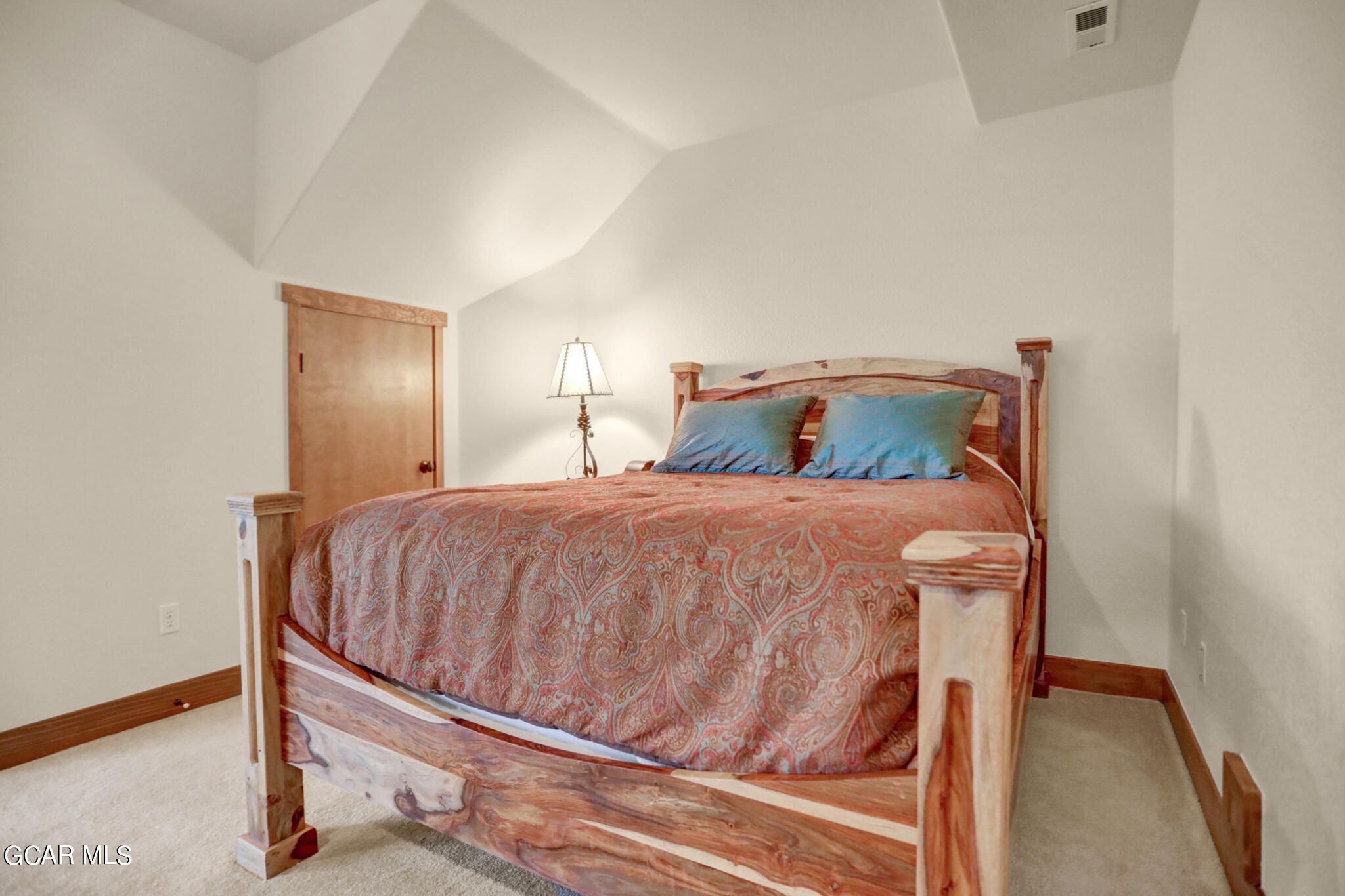 1180 Rendezvous Road Fraser, CO 80442 - Photo 21 of 44 a bedroom with a bed and wooden floor