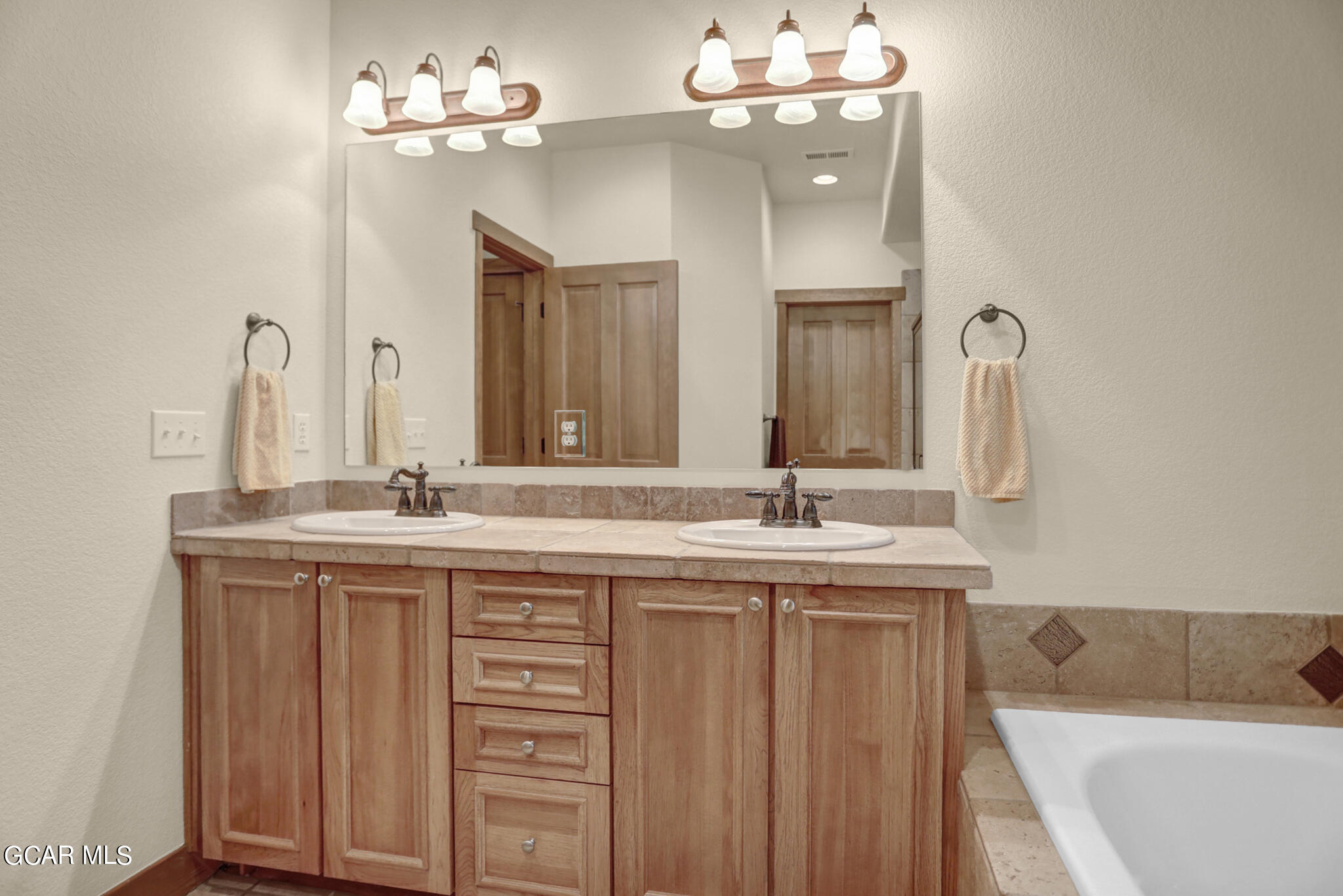 1180 Rendezvous Road Fraser, CO 80442 - Photo 23 of 44 a bathroom with a double vanity sink and a mirror