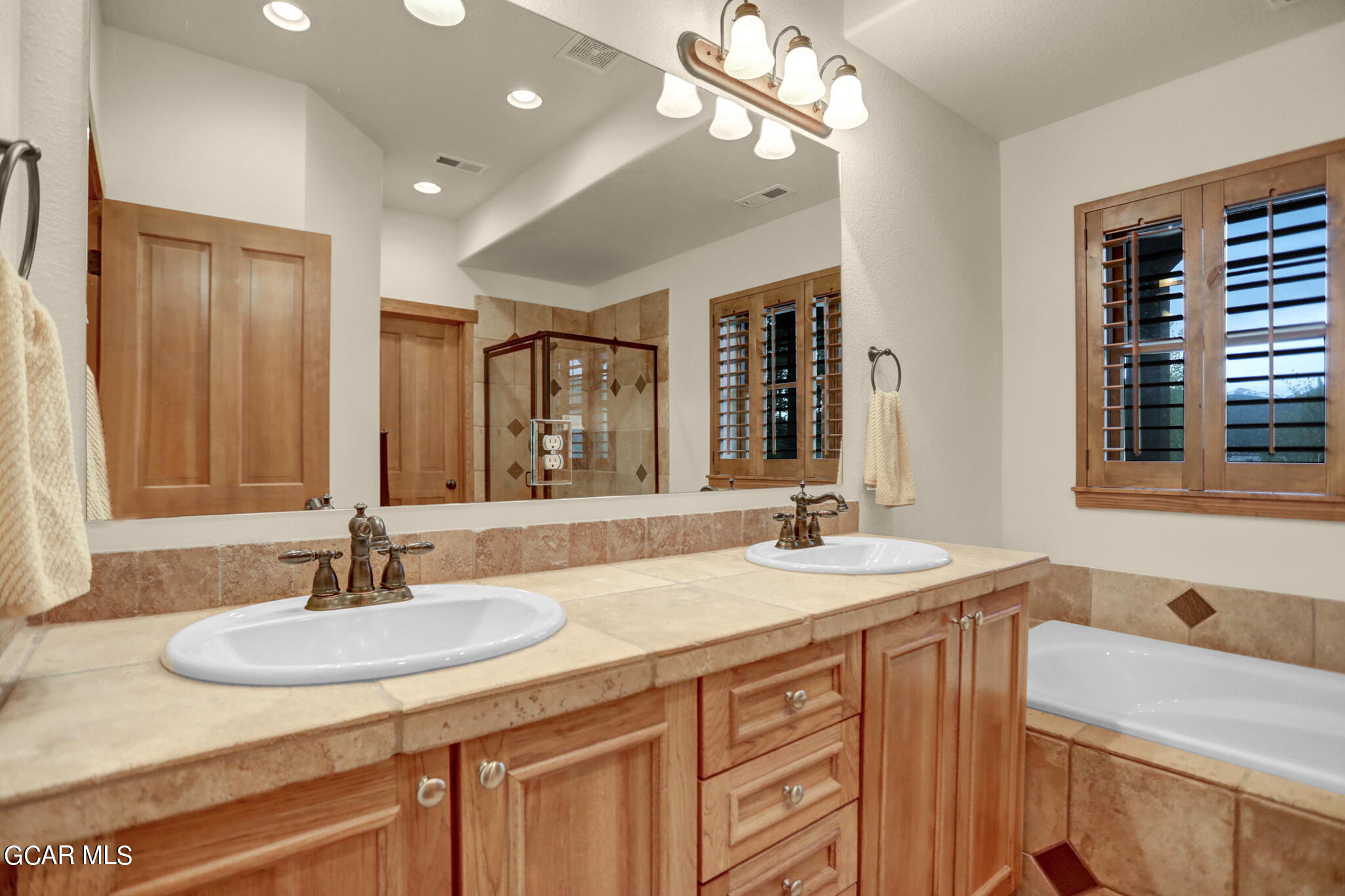 1180 Rendezvous Road Fraser, CO 80442 - Photo 24 of 44 a bathroom with a sink double vanity and a mirror