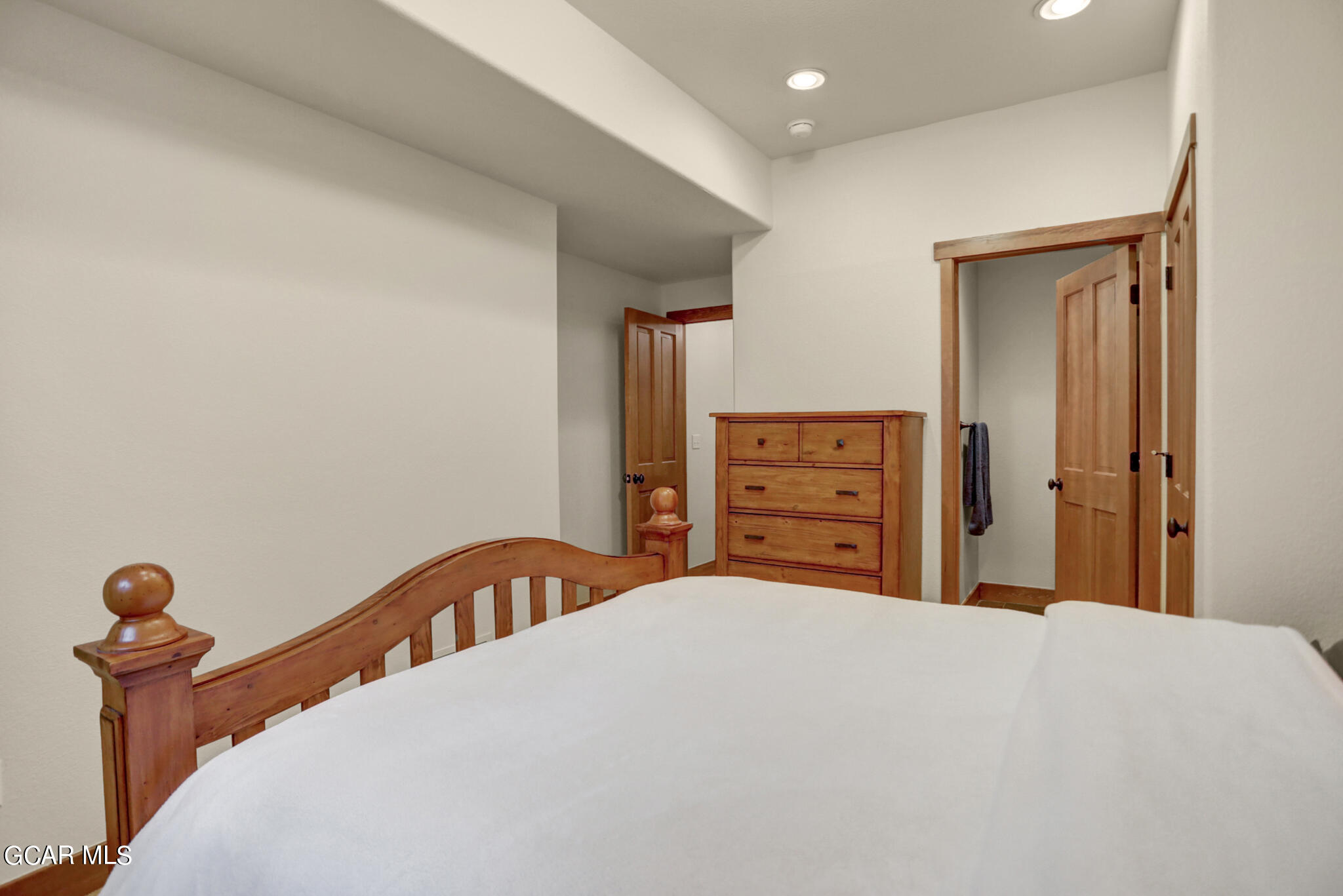 1180 Rendezvous Road Fraser, CO 80442 - Photo 30 of 44 a bedroom with a bed and dresser