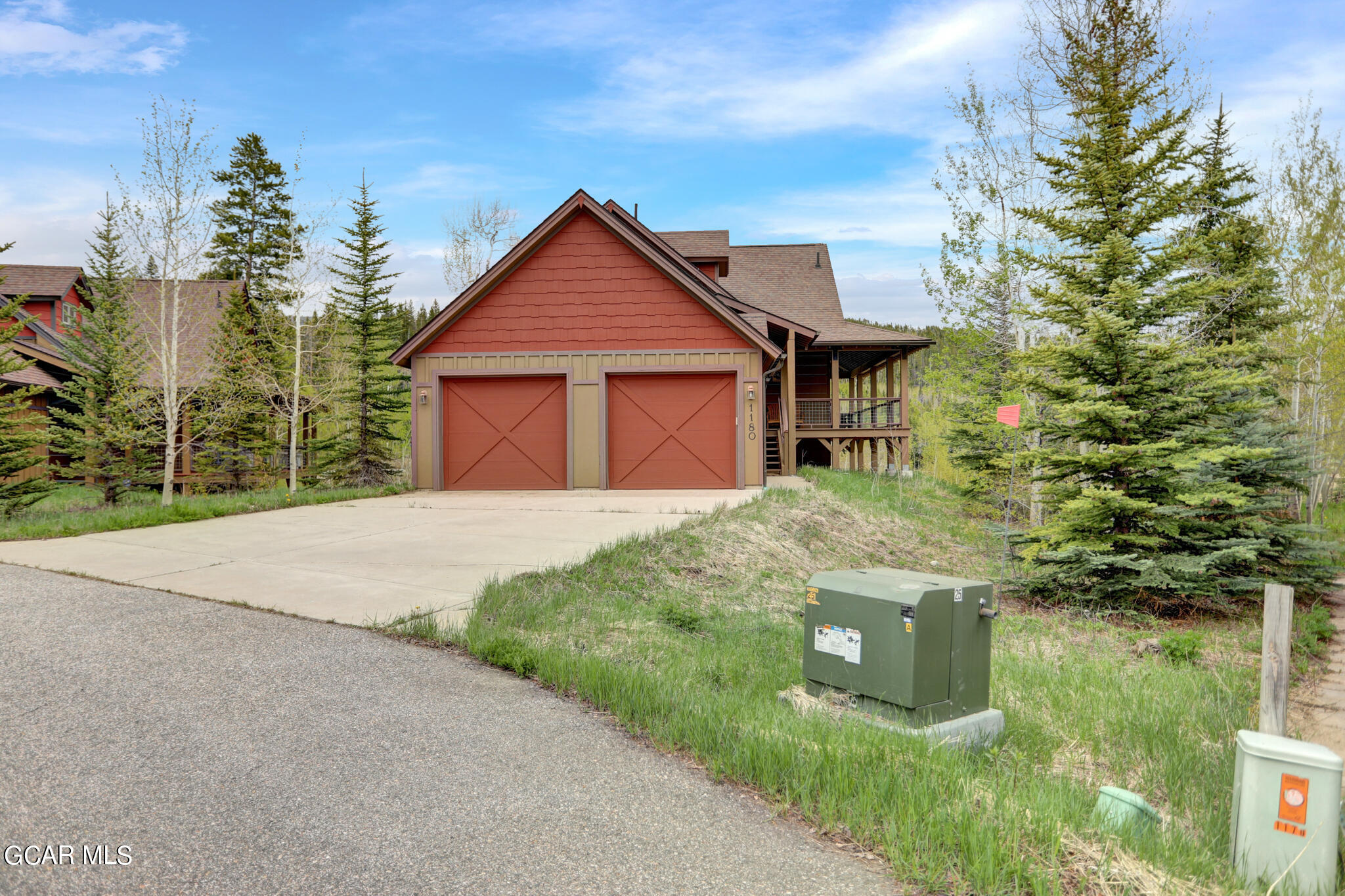 1180 Rendezvous Road Fraser, CO 80442 - Photo 3 of 44 a front view of a house with garden