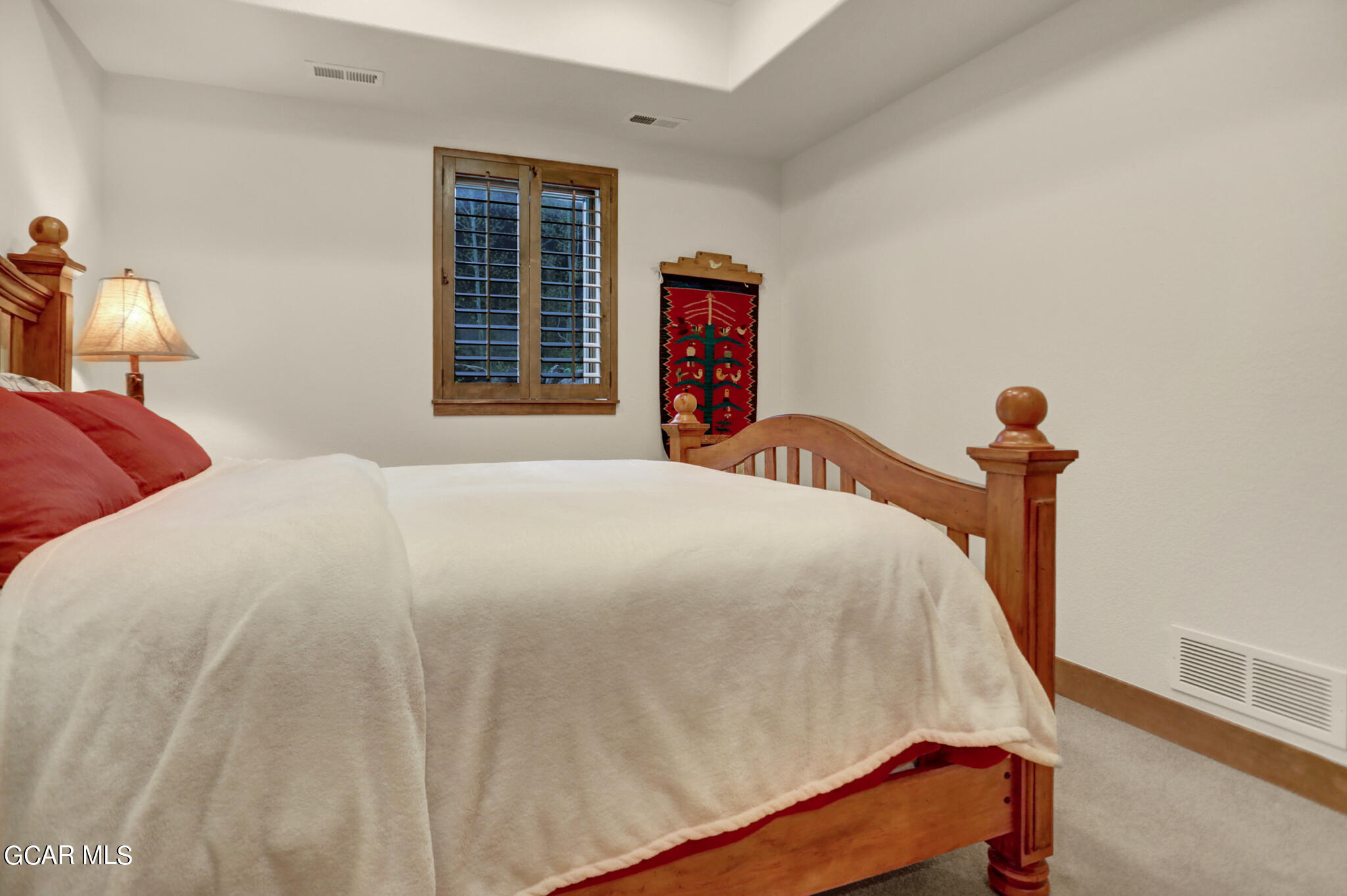 1180 Rendezvous Road Fraser, CO 80442 - Photo 32 of 44 a bedroom with bed and window