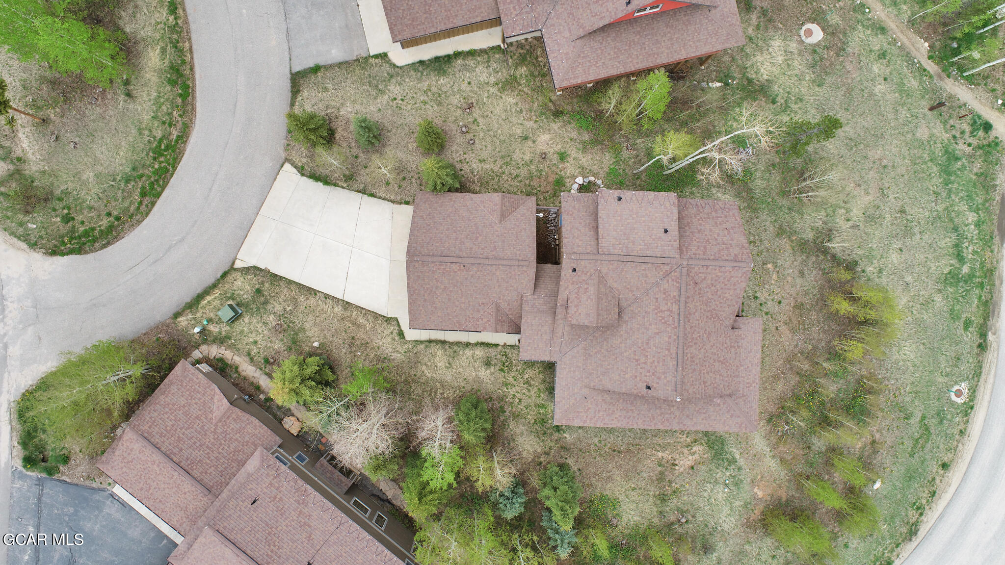 1180 Rendezvous Road Fraser, CO 80442 - Photo 42 of 44 an aerial view of a house with a yard and a large tree