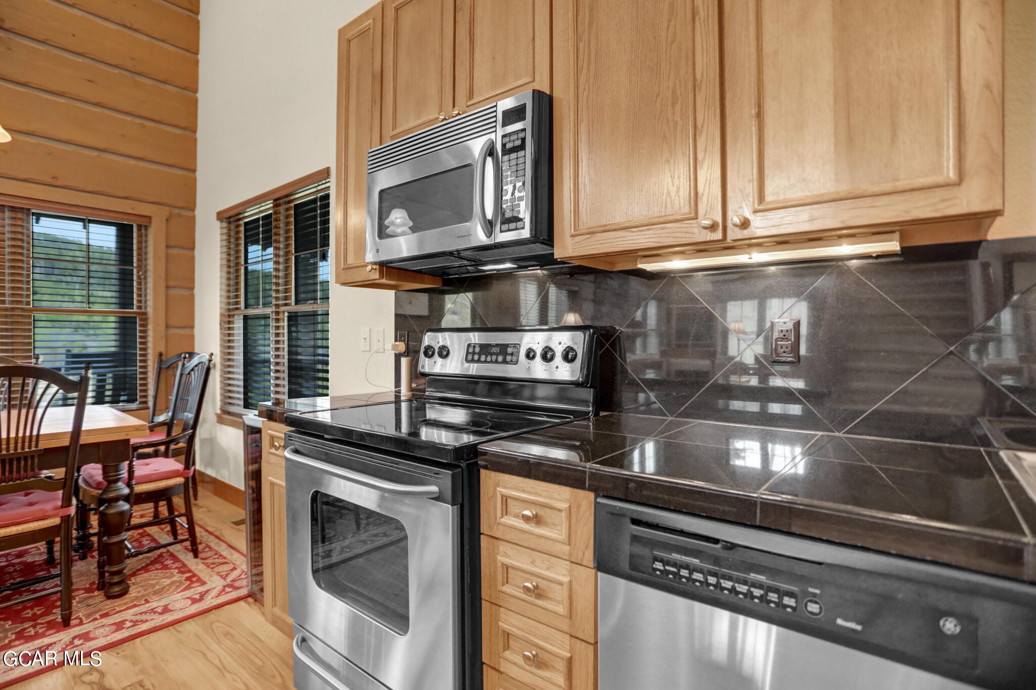 1180 Rendezvous Road Fraser, CO 80442 - Photo 7 of 44 a kitchen with granite countertop a stove and cabinets