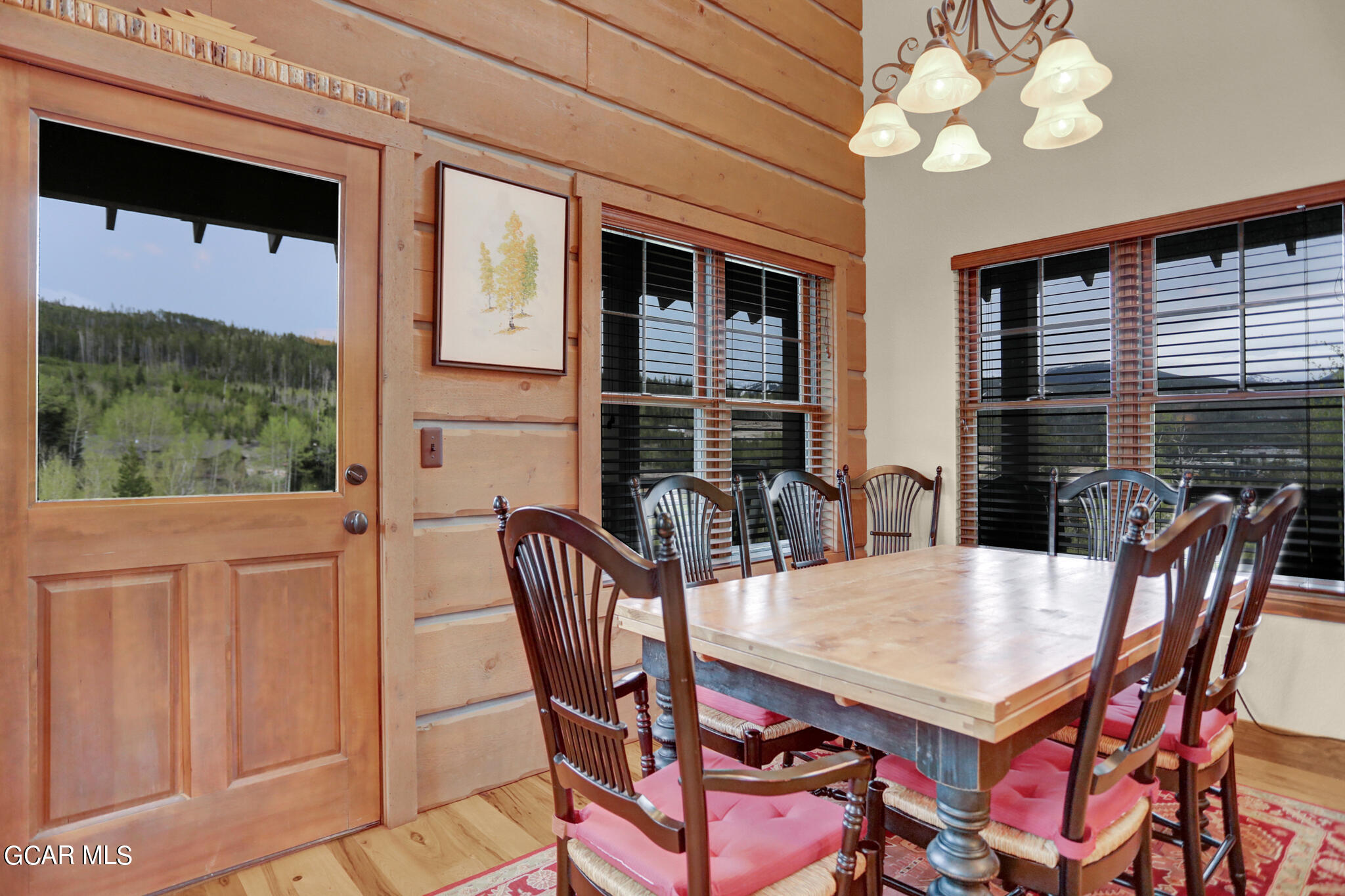 1180 Rendezvous Road Fraser, CO 80442 - Photo 9 of 44 a dining room with furniture a flat screen tv and a large window